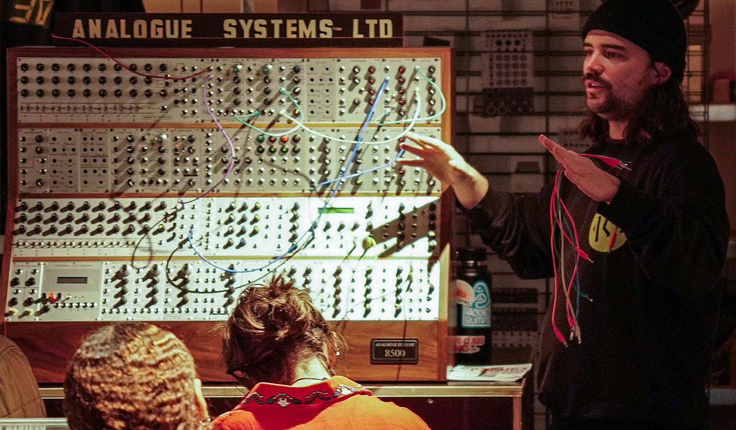 Instructor teaching modular synthesis